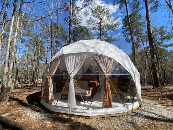 Dome exterior showing full-height windows with curtains