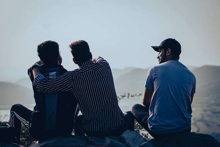 a group sitting together outside